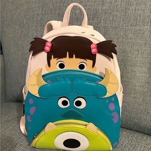 Monster Inc Backpack -White, teal, green.
Pixar, Loungefly. NWOT. In plastic.